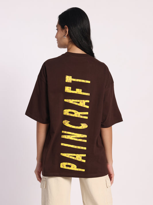 Paincraft Oversized T-Shirt for Men & Women | Brown Cotton Tee with Yellow Grunge Text Print | Unisex Streetwear Fashion